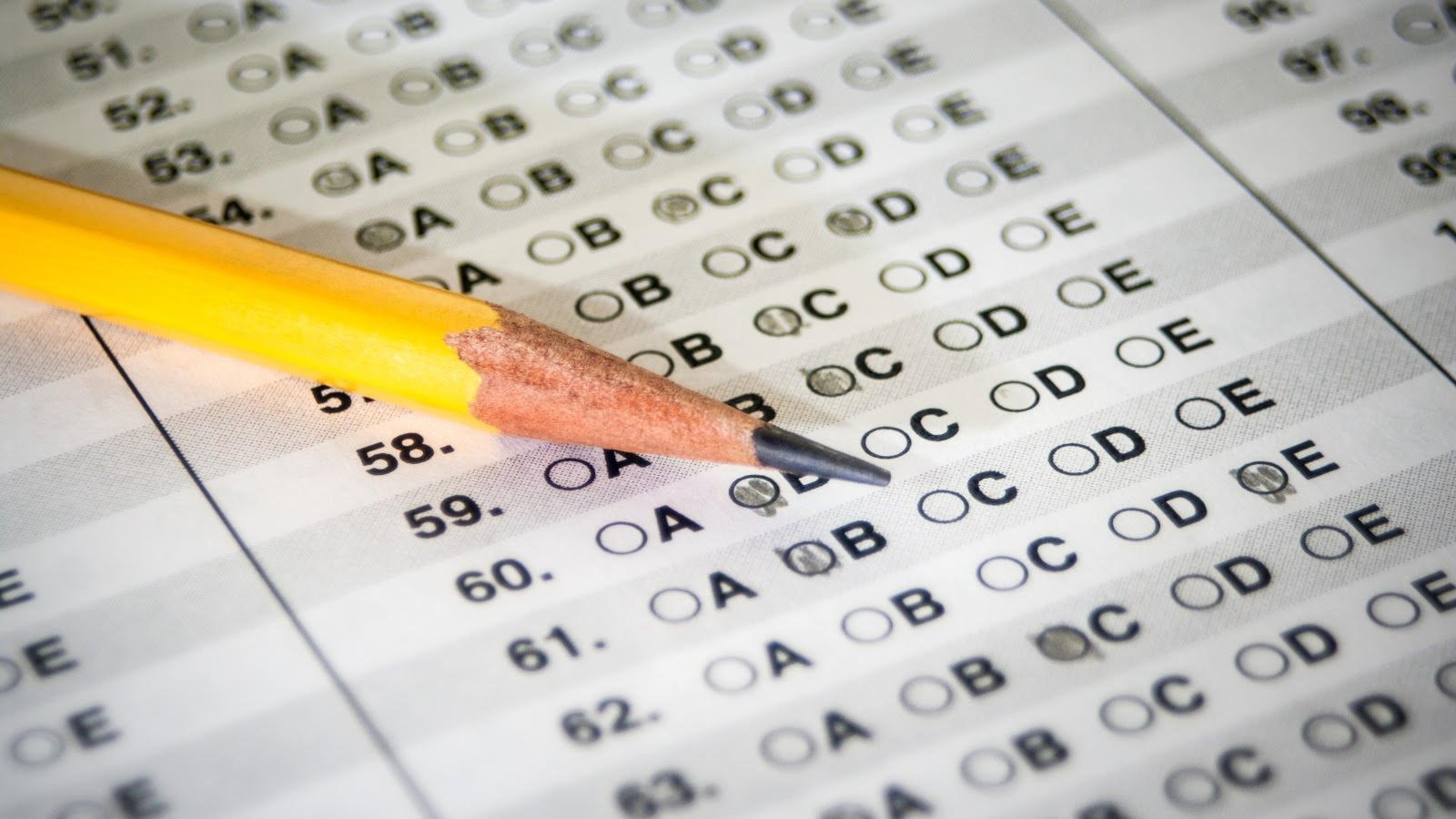Multiple-choice exam answer sheet with a pencil